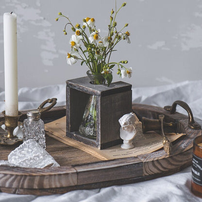 Rustic Oval Wood Tray styled for a coffee table or tabletop with small decorative ornaments.