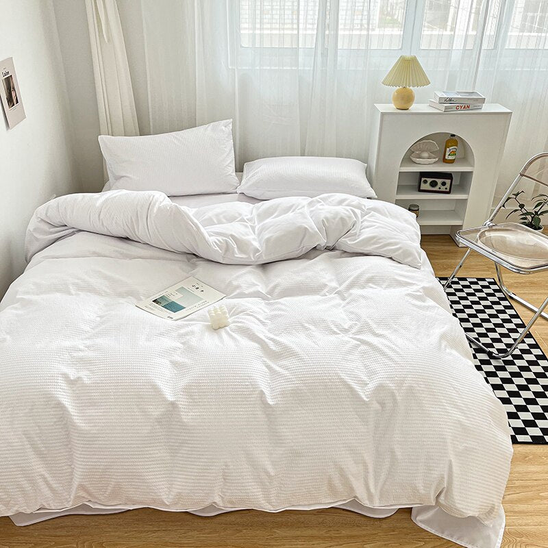 Simply Classic Duvet Cover Set 3 or 4 PC set. Easy to care for microfiber with waffle weave design on one side . Totally reversible. Shown in white.