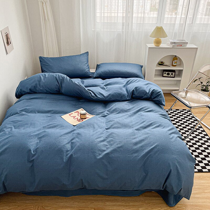 Simply Classic Duvet Cover Set 3 or 4 PC set. Easy to care for microfiber with waffle weave design on one side . Totally reversible. Shown in a medium blue.t blue.