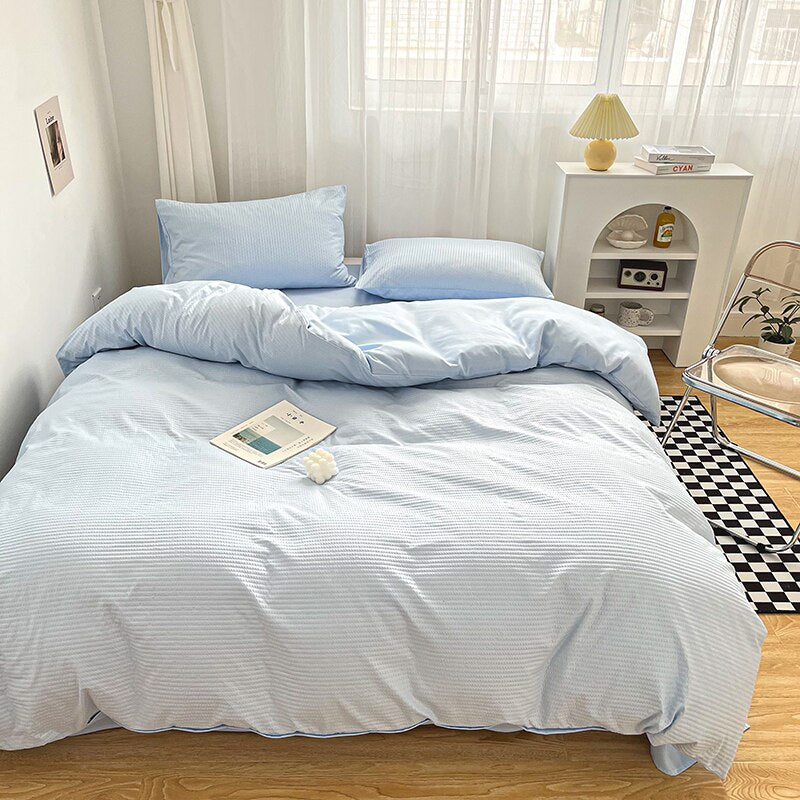 Simply Classic Duvet Cover Set 3 or 4 PC set. Easy to care for microfiber with waffle weave design on one side . Totally reversible. Shown in light blue.