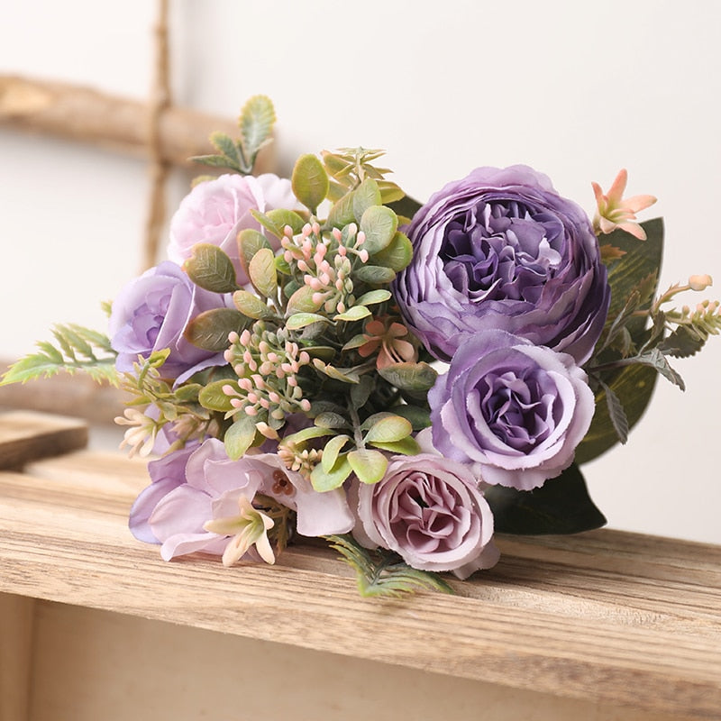 Handmade artificial silk peonies and roses bouquet.  Very light mauve  to medium mauve/purple blooms with greenery.