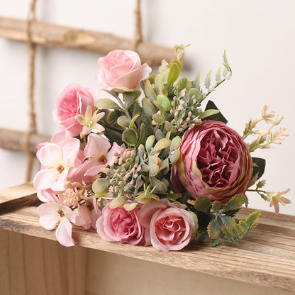 Handmade artificial silk peonies and roses bouquet.  Light blush pink to darker pink blooms with greenery.