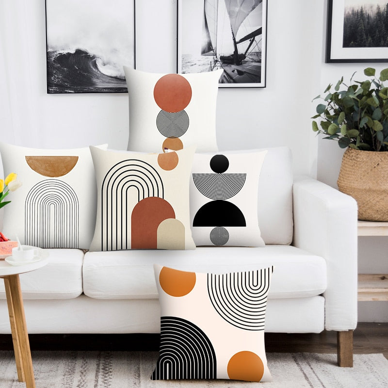 Modern Minimalist Geometric Pillow Cover.  Available in 4 sizes.  White background, orange and black geometric designs printed on one side. 