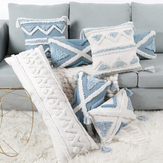Bohemian Blue Pillow Covers displayed on couch featuring all styles and sizes. White background with blue geometric design or blue background with white geometric design. 