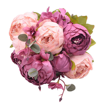 1 bunch of soft pink and darker pink European Silk Peonies complete with muted green leaves.