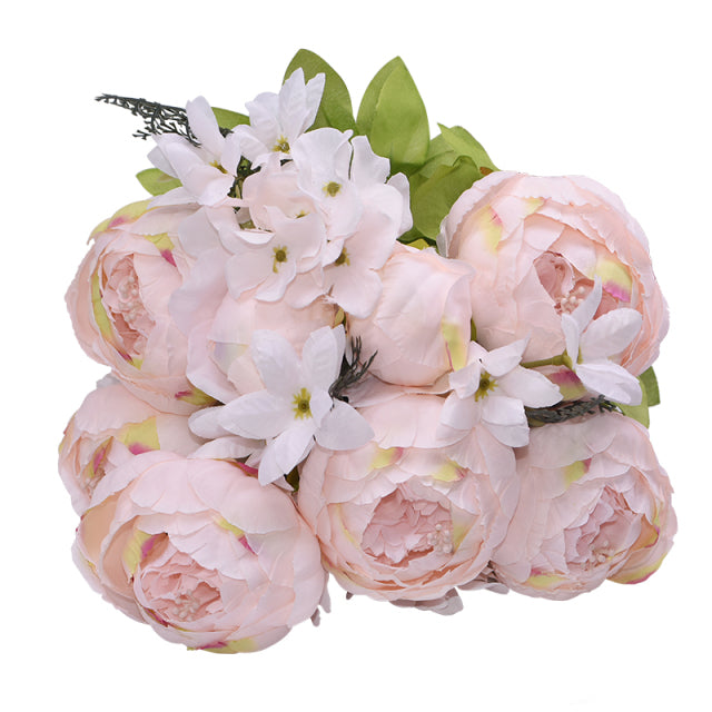 1 bunch of very soft blush pink European Silk Peonies complete with muted green leaves.