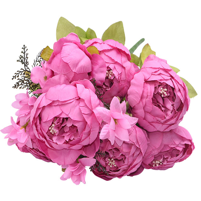 1 bunch of brilliant pink European Silk Peonies complete with muted green leaves.