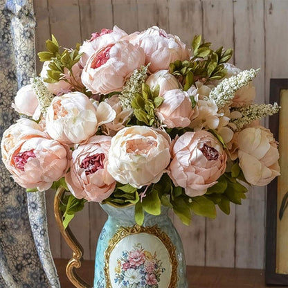 2 bunches soft pink European Silk Peonies in a French country vase .