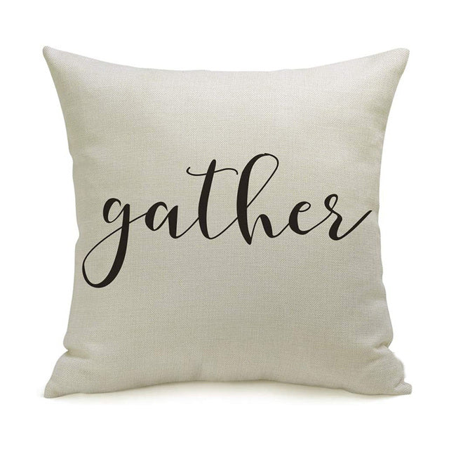 Autumn Farmhouse Pillow Cover.  Natural texture of linen look fabric covers depicting country charm.  Text is black with a brushed lettering style font on a warm white background.  "Gather".