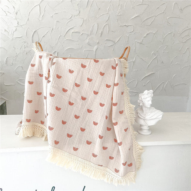 Bamboo and Cotton Muslin Baby Swaddle Blanket.  Creamy white background with beige rainbows complete with creamy white fringed edging.    2 sizes available 47"X40" or 31"X25"